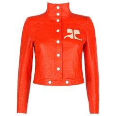 COURREGES PARIS, giacca in ecopelle arancione con logo Mod Vinyl del 1970 ca.