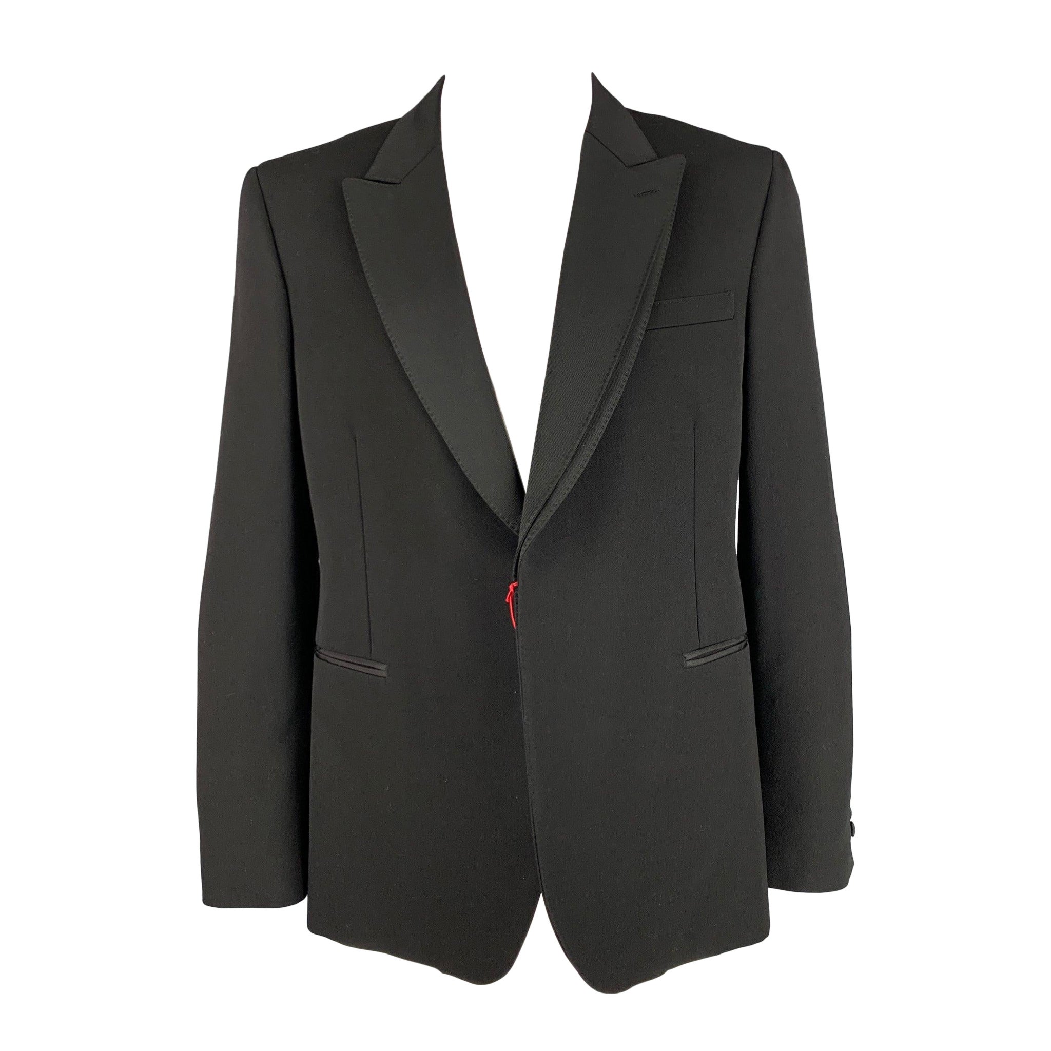 ALEXANDER MCQUEEN - Manteau de sport en laine noir à revers pointu, taille 44 en vente