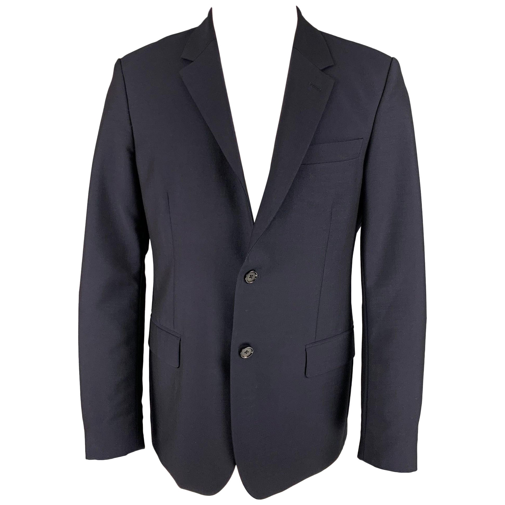 ALEXANDER MCQUEEN - Manteau de sport en laine et mohair bleu marine à revers clouté, taille 42 en vente