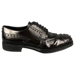 PRADA Taille 10.5 Chaussures à lacets en cuir noir clouté