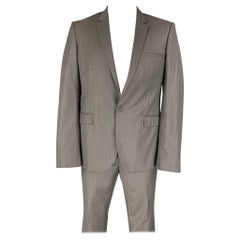 CALVIN KLEIN COLLECTION - Costume en laine tissée grise à revers clouté, taille 44