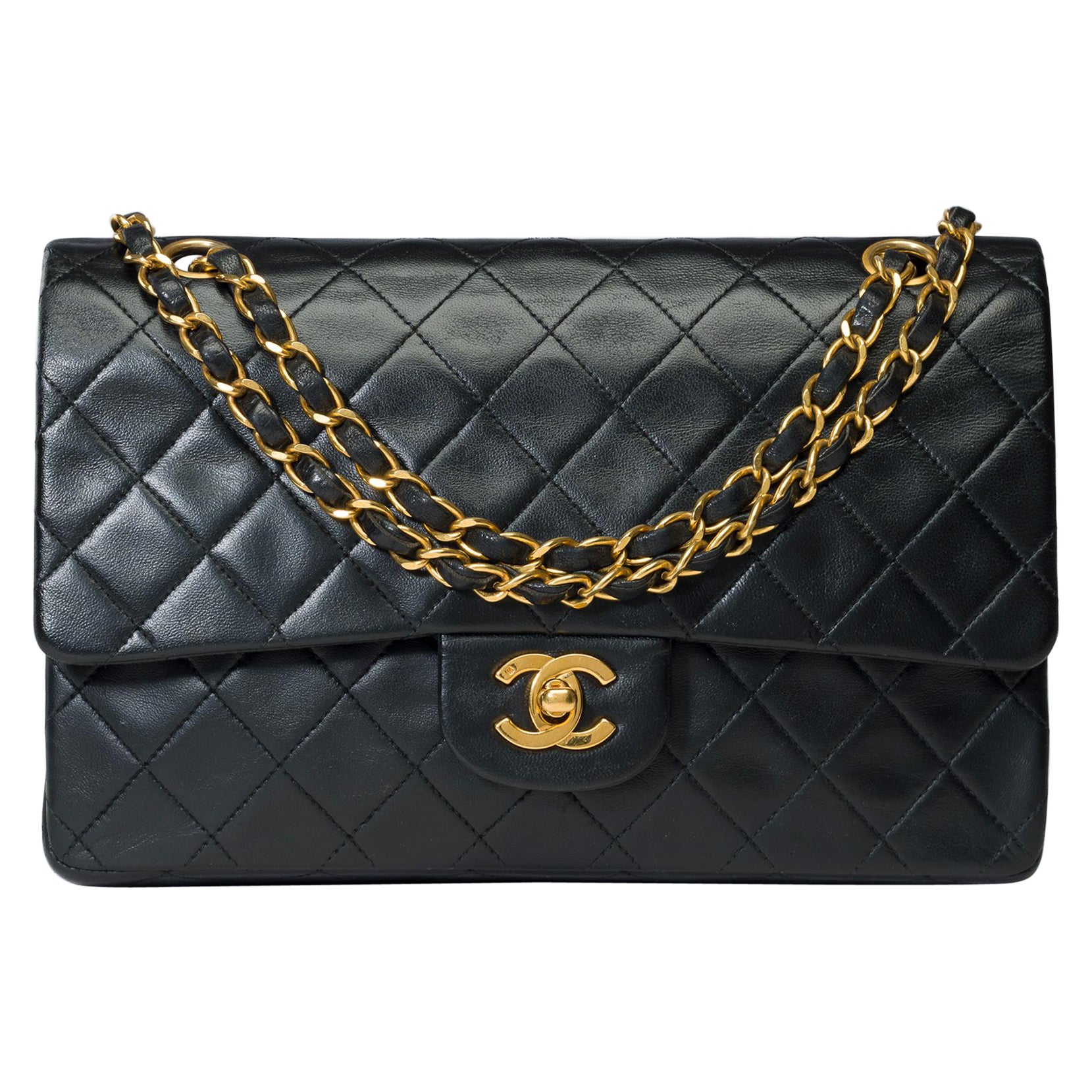 Chanel Timeless double flap shoulder bag in black quilted lambskin leather, GHW For Sale