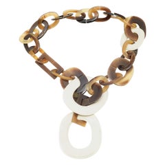 Collier Hermes en corne brune et cuir blanc