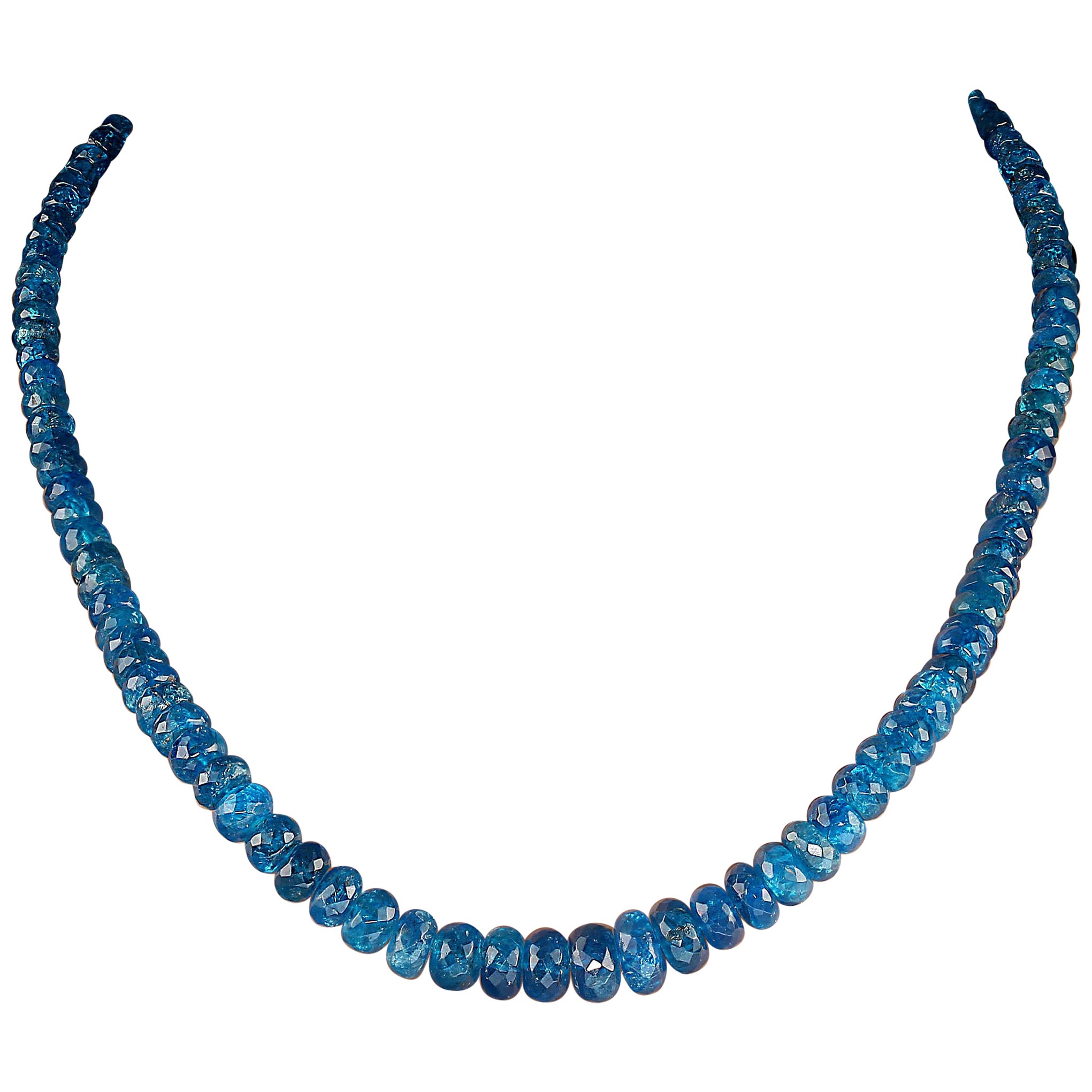 19-Inch neon apatite necklace of graduated faceted rondelles. This one-of-a-kind necklace fairly glows.  The rondelles graduate from 4 to 10 MM.  At 19 inches it sits perfectly on your neck and is lovely both day and evening.  It is secured with a