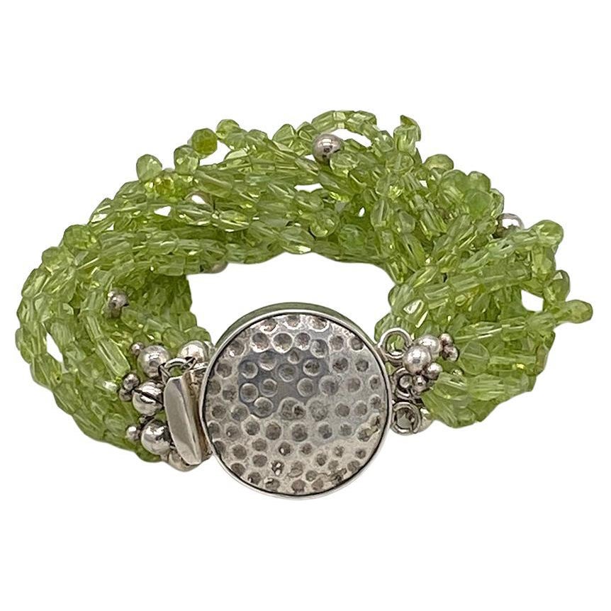 Multi-strand Peridot Bracelet with Hammered Sterling Clasp For Sale