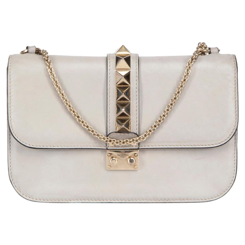 How can I tell if a Valentino Garavani purse is real?