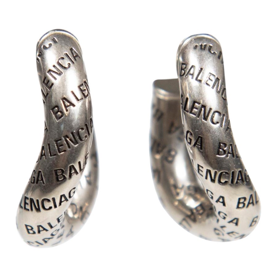 Balenciaga Antique Silver Loop Logo Earrings For Sale