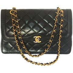 Vintage Chanel black 2.55 classic double flap bag with gold and silver CC motif 