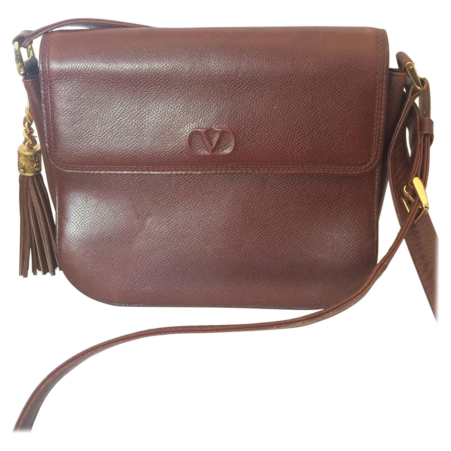 Vintage Valentino Garavani dark brown leather shoulder bag with tassel  charm. at 1stDibs | vintage valentino bags, valentino bag vintage