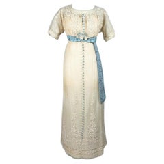 A neo-classical dress in embroidered cotton tulle and taffeta -France Circa 1910