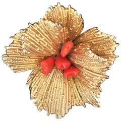 Gold floral brooch with coral center Grosse Germany 1960s