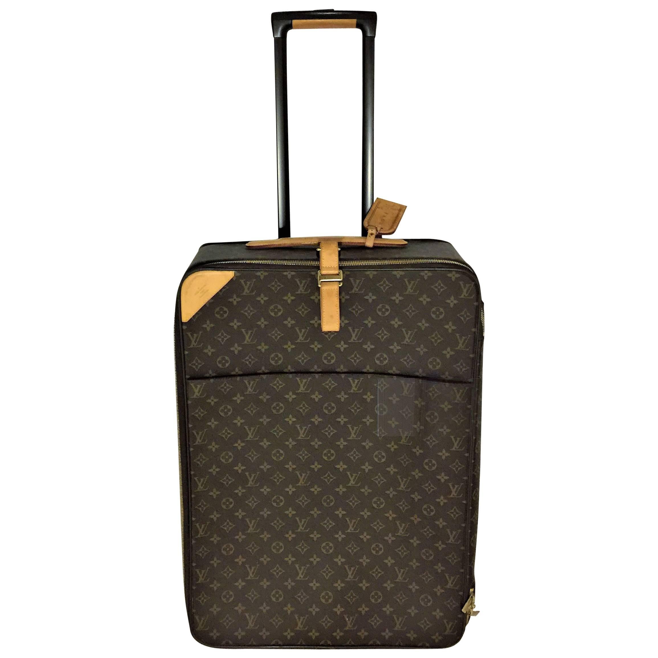 Louis Vuitton Pegase 65 monogram rolling suitcase.