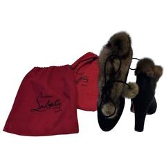 Christian Louboutin Mink fur-trimmed ankle boots.  