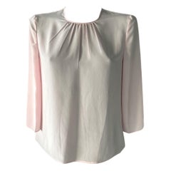 Maglia rose Prada con fiocco dietro al collo