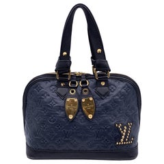 Louis Vuitton - Sac Neo Alma Double Jeu en cuir bleu monogrammé