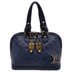 Louis Vuitton - Sac Neo Alma Double Jeu en cuir bleu monogrammé