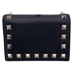 Valentino - Portefeuille à rabat français compact en cuir noir Rockstud