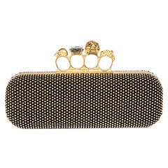 Alexander McQueen Goldene Clutch mit Nieten und Messingknuckles in Schachtel