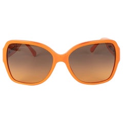 Lunettes de soleil Chanel orange avec logos CC