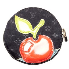 LOUIS VUITTON Mini Monogram Conte de Fees Apple pochette à monnaie ronde noire