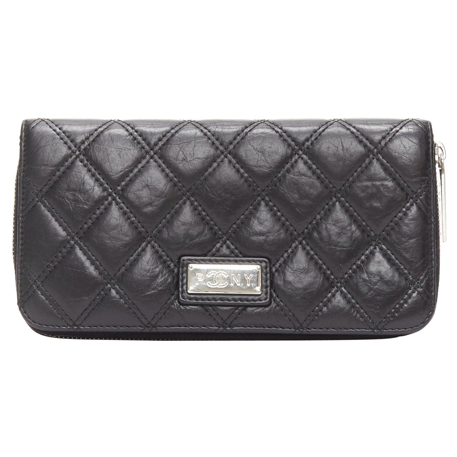 CHANEL Paris New York black quilted leather silver logo long zip wallet For Sale