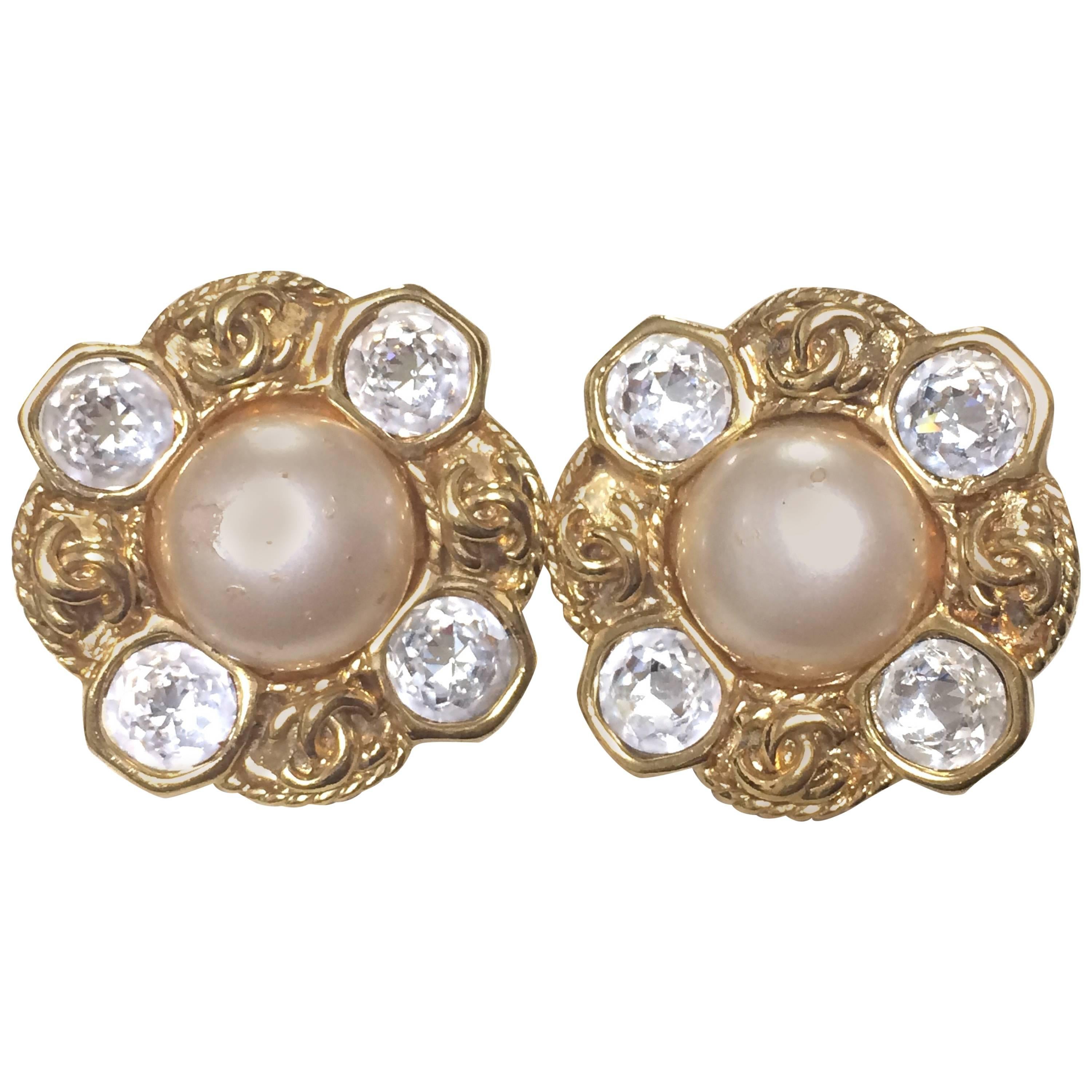 Vintage CHANEL gold tone earrings with a faux pearl, Swarovski crystal stones For Sale