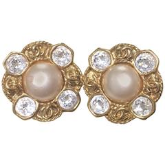 Vintage CHANEL gold tone earrings with a faux pearl, Swarovski crystal stones