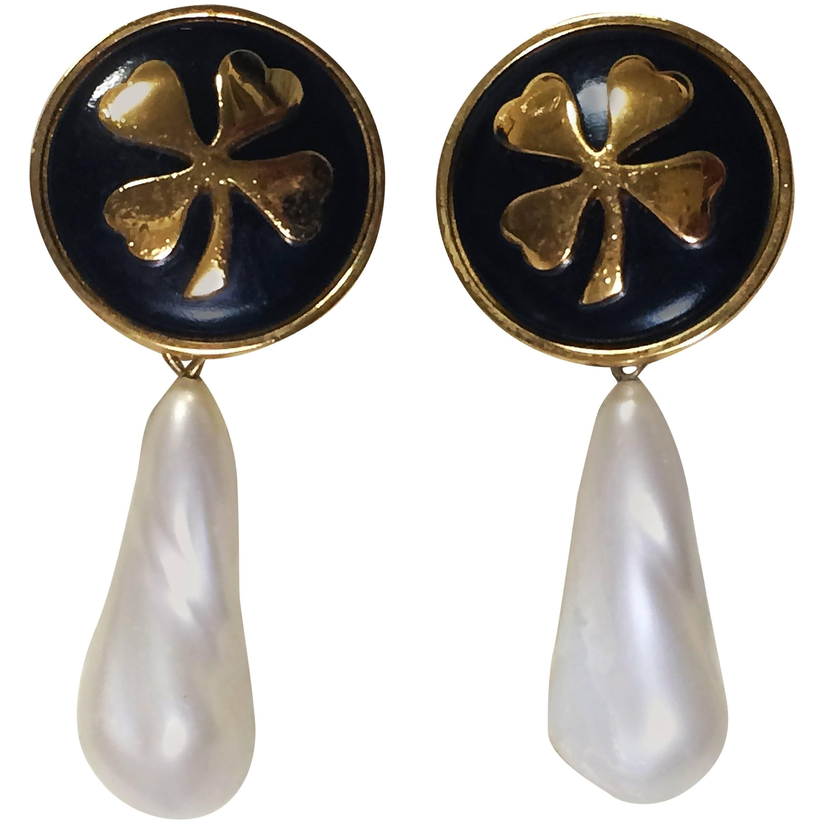 Vintage CHANEL white teardrop faux pearl earring with black and gold clover mark