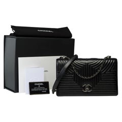 Außergewöhnliche Chanel Coco Umhängetasche mit Klappe aus schwarzem gestepptem Leder, ASHW
