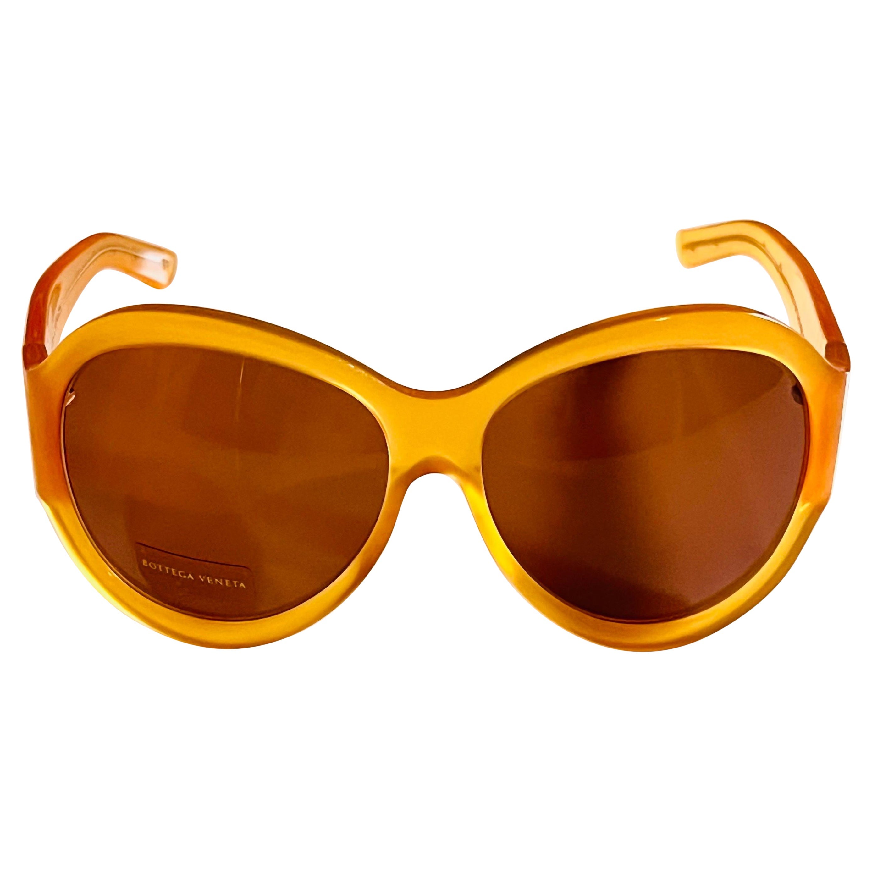 Vintage 1990s Bottega Veneta sunglasses in honey colour with butterfly detail For Sale