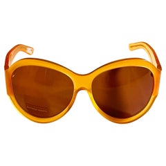 Retro 1990s Bottega Veneta sunglasses in honey colour with butterfly detail
