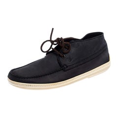 Tod's Baskets montantes bleu marine en cuir et dentelle, taille 41,5