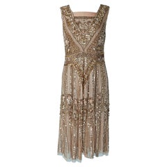 Sleeveless cocktail dress with gold sequin embroideries 1920's style 
