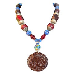 LB offers French Bakelite Carved Pendant Venetian glass Tibetan Wood necklace