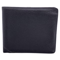 Used Louis Vuitton Black Taiga Leather Cards and Bill Bifold Wallet