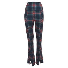 Norma Kamali Leggings à carreaux verts en maille extensible, taille haute et ourlet évasé L