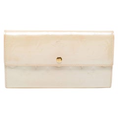 Louis Vuitton - Portefeuille Sarah en cuir vernis avec monogramme corail blanc