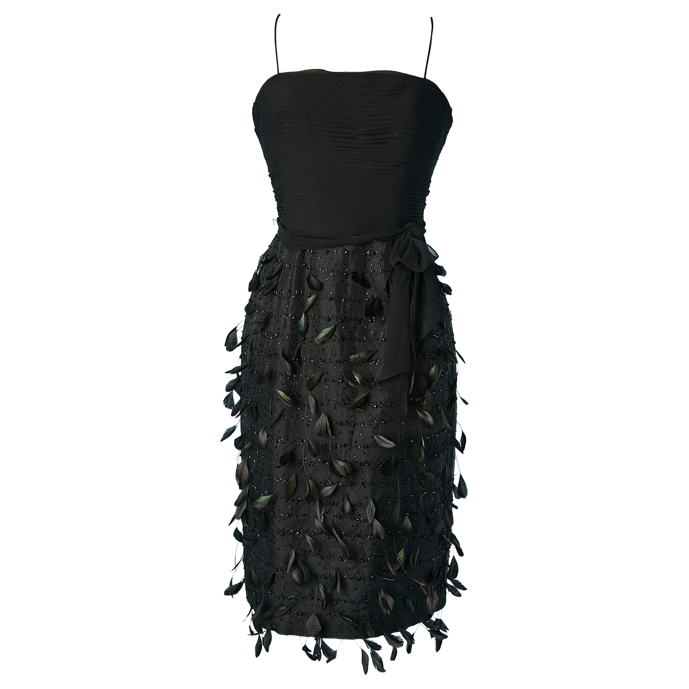 Black bustier cocktail dress with beads and feathers embellishment Circa 1960's For Sale