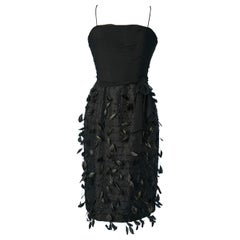 Vintage Black bustier cocktail dress with beads and feathers embellishment Circa 1960's 