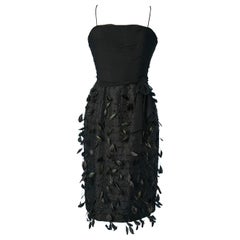 Black bustier cocktail dress with beads and feathers embellishment Circa 1960's