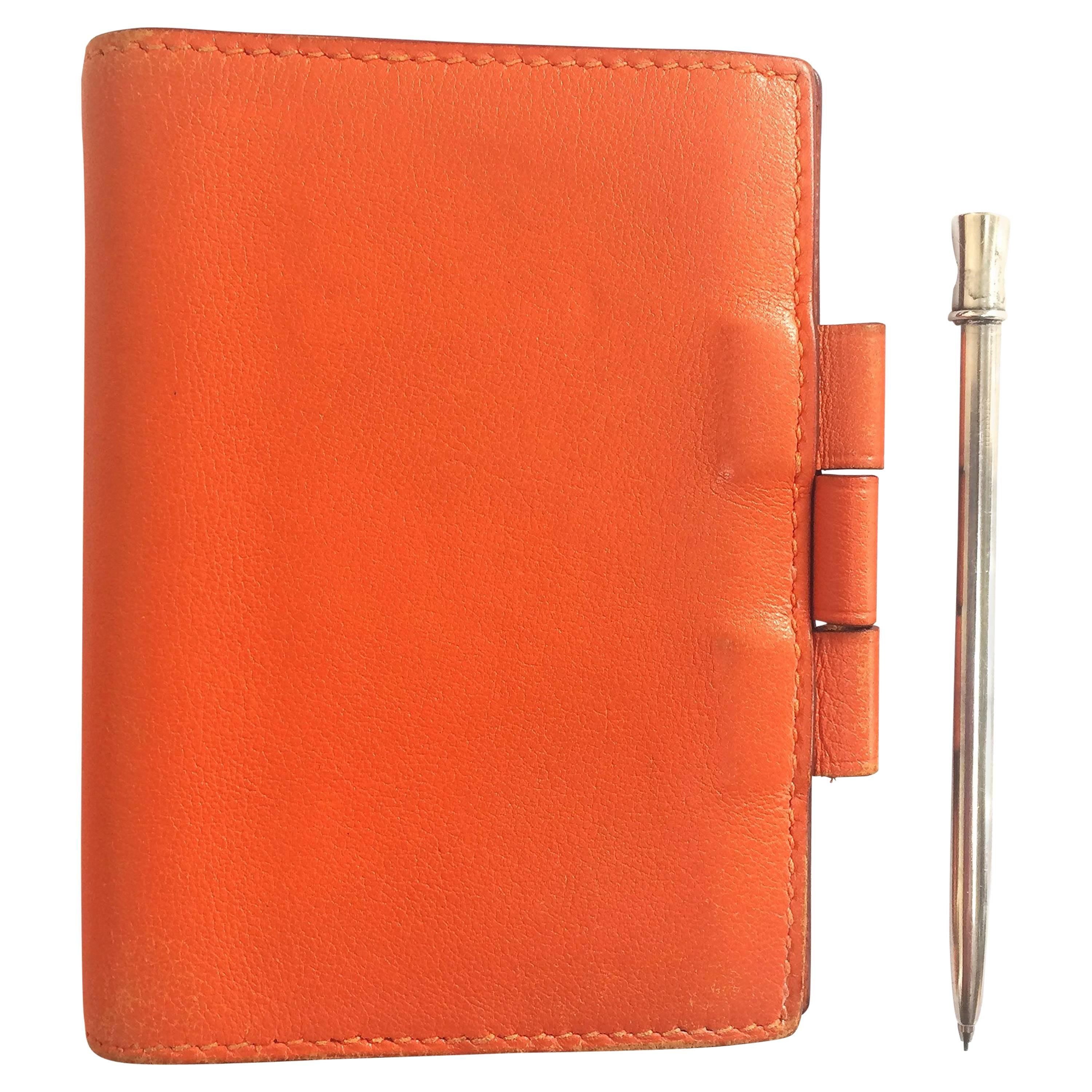 Vintage HERMES orange leather diary, schedule book cover PM with silver pencil For Sale