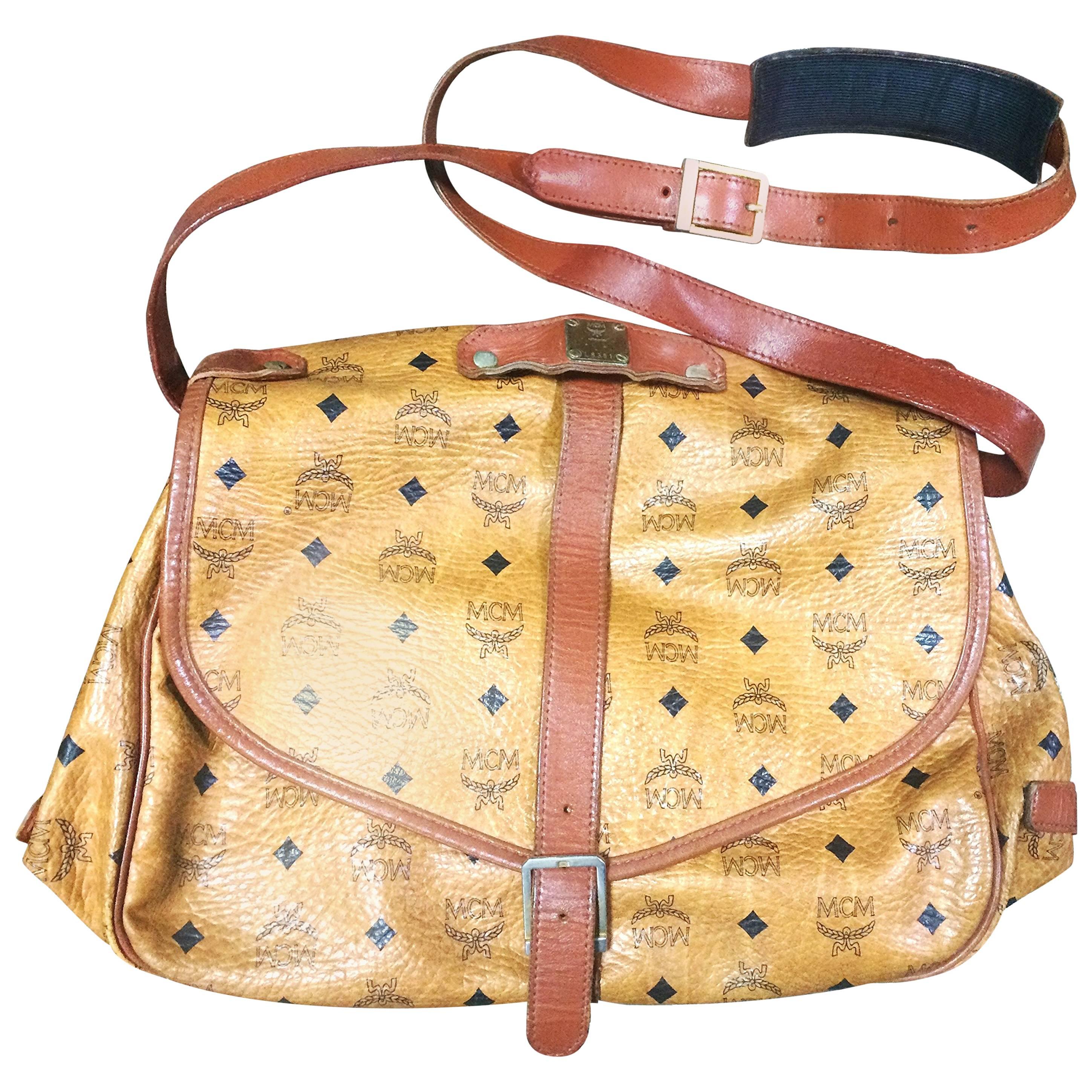 Vintage MCM brown monogram saumur messenger shoulder bag with leather trimmings.