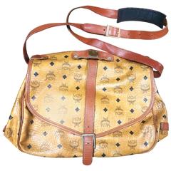 Vintage MCM brown monogram saumur messenger shoulder bag with leather trimmings.