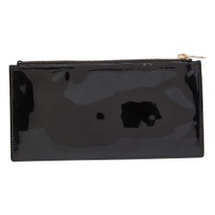 Estuche Dior de charol negro con cremallera