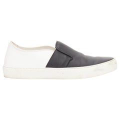 CHANEL schwarz weißes Leder CC Logo zurück minimal klassische Schlittschuhe Turnschuhe EU36