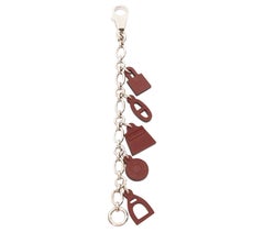 HERMES Breloque Olga Amulet dark brown leather charms silver bag chain