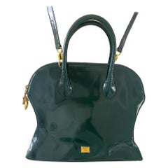 Moschino by Redwall 1990s Bolso bandolera de tejido de piel verde con colgante de corazón