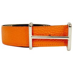 Ceinture Hermès orange à revers en chamonix et noir avec boucle en palladium