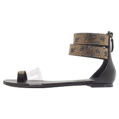 Casadei Sandalias con correa en el tobillo de cuero negro/oro y PVC Vinil talla 37