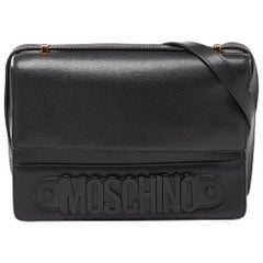 Moschino - Borsa a tracolla con patta in pelle nera con logo